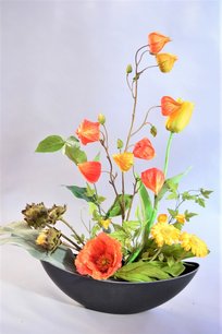 Bloemstuk kunstbloemen zomer Bloemstuk kunstbloemen zomer